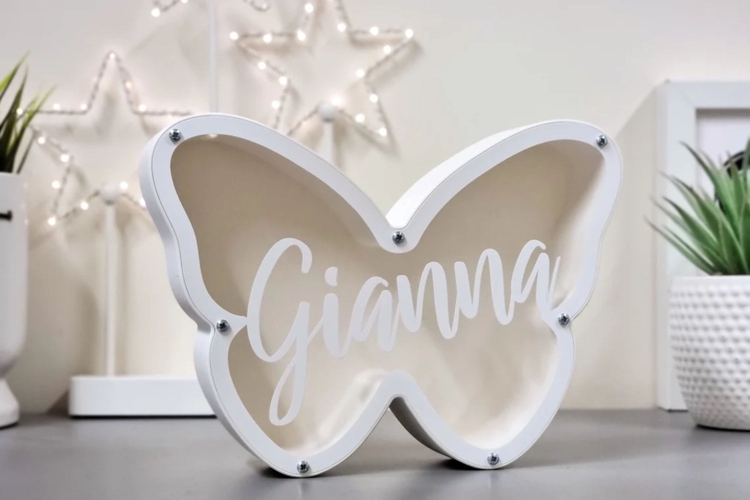 White butterfly-shaped personalized piggy bank with the name 'Gianna', perfect for kids' savings or as a decorative gift.