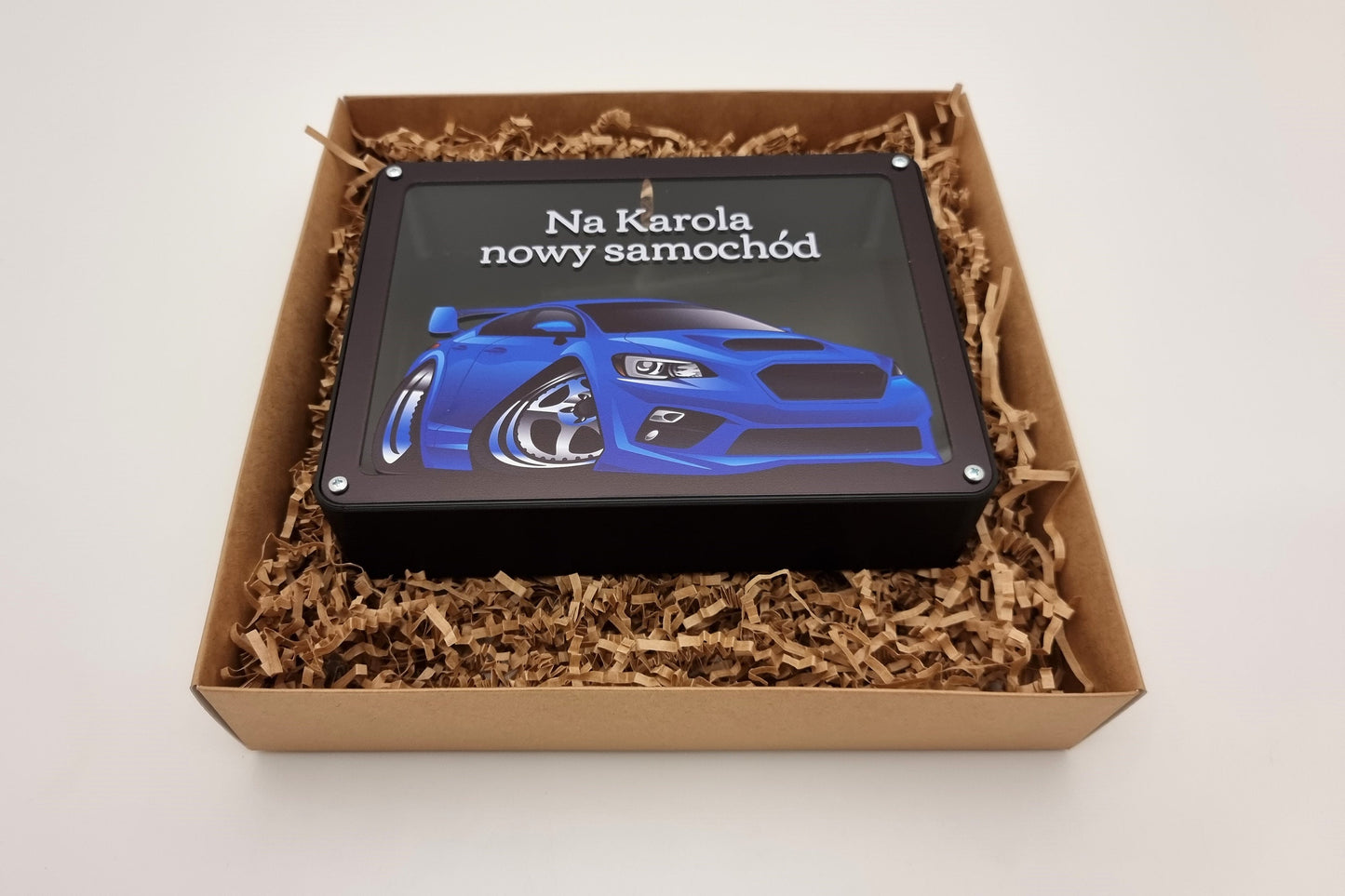 Personalized car piggy bank displayed in a gift box, ready for gifting.