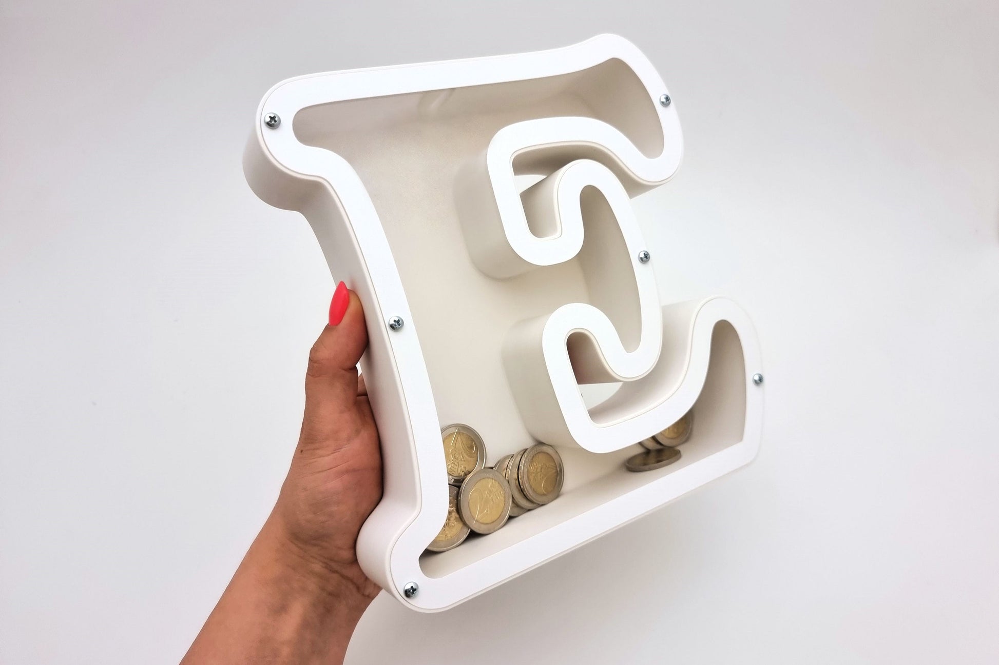 Personalized letter E piggy bank held in hand, showcasing its sleek and modern design