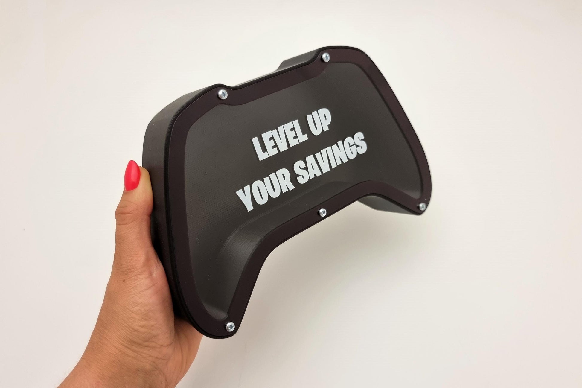 Gaming controller piggy bank with phrase Level up your savings - Perfect gift for gaming lovers!