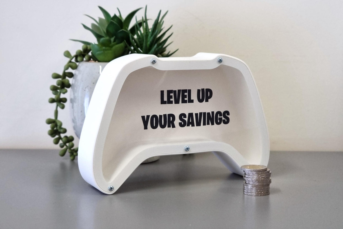 Gaming controller piggy bank with phrase Level up your savings - Perfect gift for gaming lovers!